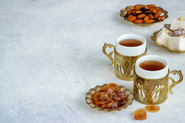 Tea party concept. Traditional Turkish tea with sweets and nuts