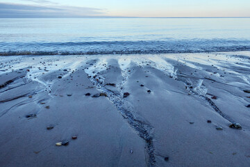 Northern seascape. Tersky coast of the White Sea. Murmansk region, Russia. The White Sea coast in Karelia in summer. Low tide. Littoral.