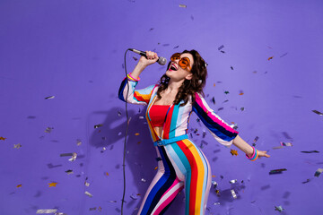 Photo of dreamy pretty lady wear striped overall dark glasses singing discotheque songs isolated...