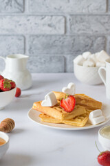 breakfast waffles with cream cheese strawberries and white marshmallows