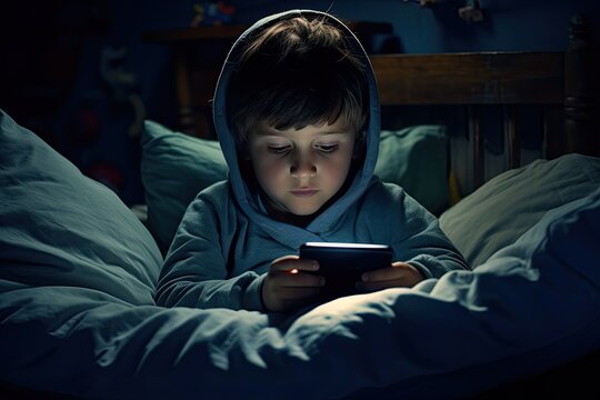 Modern Childhood Addictions. The Boy Can't Take His Eyes Off The Smartphone Screen. He Communicates Online With The Same Dependent Children.