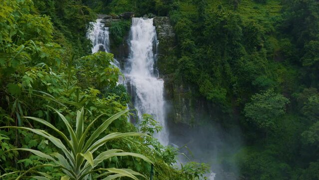 Ramboda Falls. Sri Lanka. Powerful stream of water in rocky mountains.