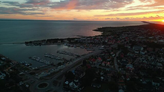 beautiful sunset at Jastarnia town, Poland, Hel peninsula, aerial drone view, 4k