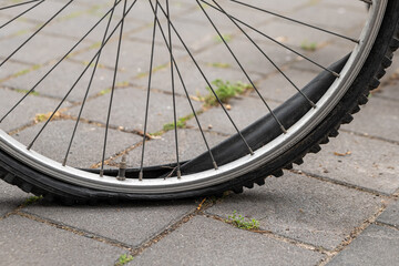 a broken bicycle tire on a rim