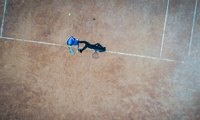 Aerial view of tennis game on court top view