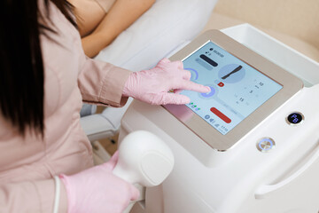 Modern equipment for laser hair removal and hair removal in a beauty salon. Beauty salon and cosmetology. Elos Laser Legs Hair Removal. Epilation Treatment In Cosmetic Beauty Clinic