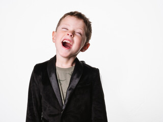 Portrait of screaming child standing alone on white background