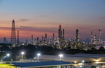Industry Oil refinery oil and gas refinery background, Business petrochemical industrial, Refinery oil and gas factory power and fuel energy, Ecosystem estates. Fuel refinery industry at evening light