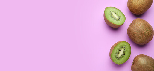 Fresh kiwi fruit on lilac background with space for text, top view - obrazy, fototapety, plakaty