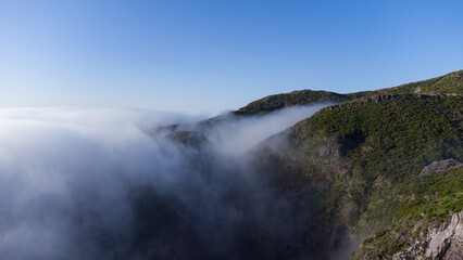 Aerial drone view over the foggy mist on the mountain tops of Madeira