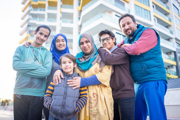 Fototapeta na wymiar Real Muslim family on city street together