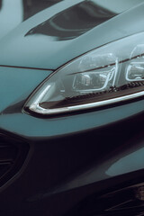 Obraz na płótnie Canvas Close-up photo of a car headlight