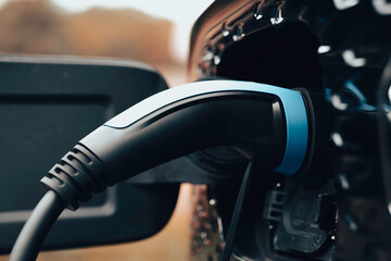 Obraz premium Electric vehicle charging plug, EV charger