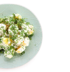 Plate of tasty Potato Salad with greens on white background, closeup