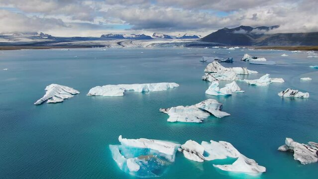 jokulsarlon iceberg glacial lagoon aerial view drone summer time sunny day iceland