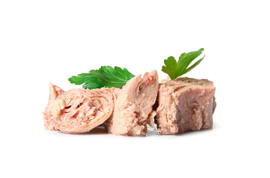 Delicious canned tuna with fresh herbs isolated on white background