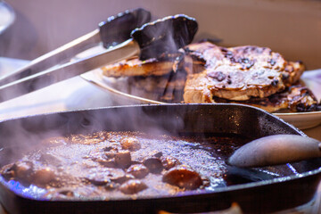 Pork chops with balsamic reduction and orzi.