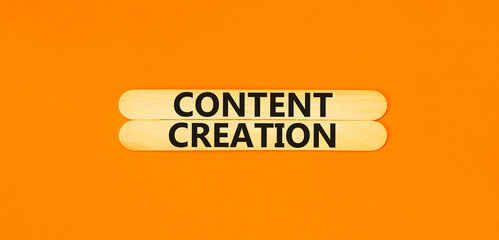 Time for content creation symbol. Concept words Content creation on beautiful wooden stick. Beautiful orange table orange background. Business time for content creation concept. Copy space.
