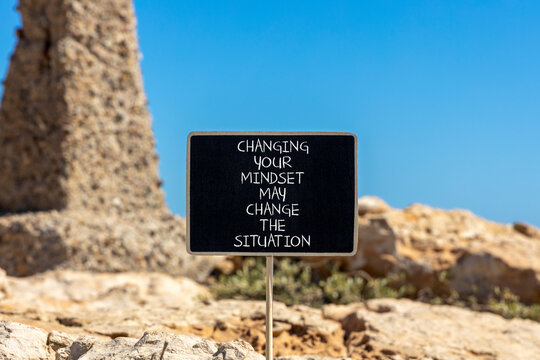 Changing mindset symbol. Concept words Changing your mindset may change the situation on beautiful black blackboard on a beautiful stone background. Business motivational Changing mindset concept.