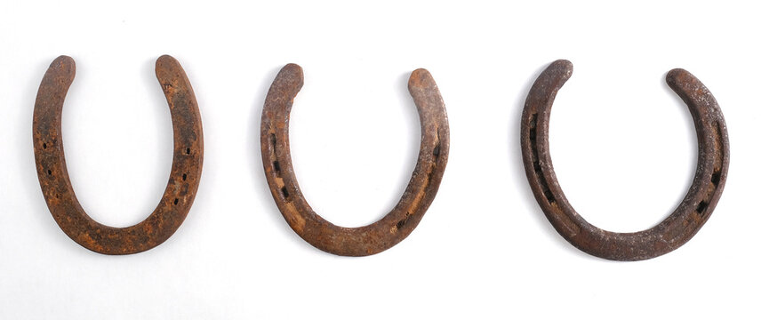 Rusty horseshoe art shows equine western shoes isolated on white background banner.