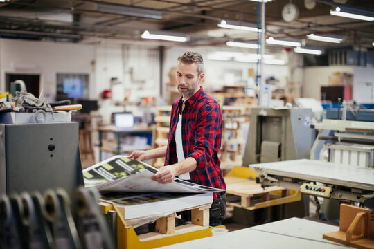 Man working in a printing press office