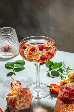 alcoholic cocktail with wine, strawberry in glasses, vertical image. top view. place for text