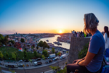 Porto, Portugal - Enjoying the stunning sunset above the Douro river in Porto during summer