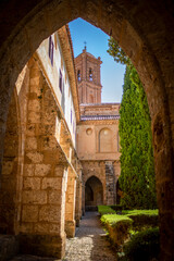Fototapeta na wymiar Cistercian cloister of the Monasterio de Piedra in Zaragoza, Aragon, Spain with the church tower in the background