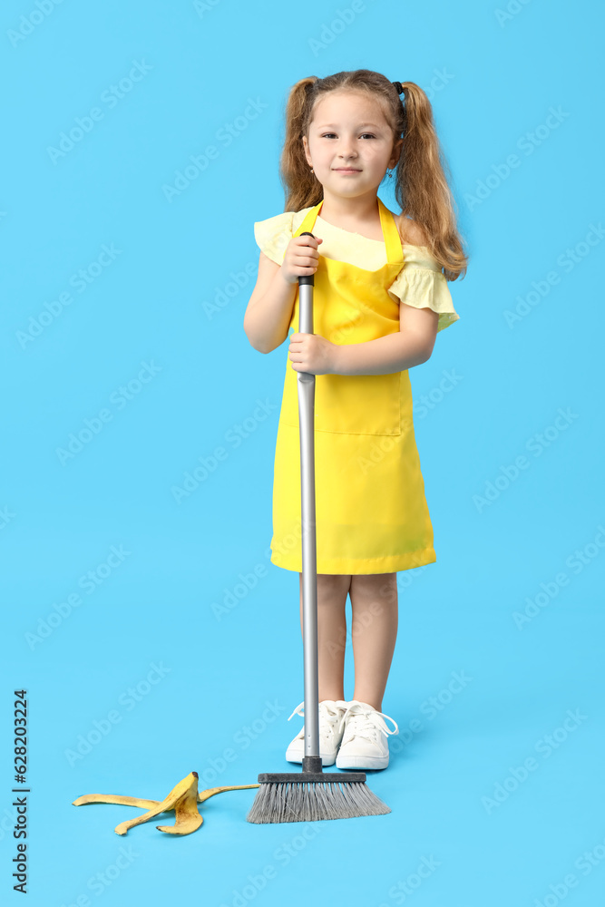 Sticker Cute little girl with broom and banana peel on blue background