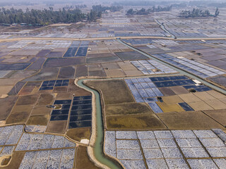 Obraz premium Aerial view of natural salt field on the coast of bashkhali Island in Chittagong, Bangladesh.