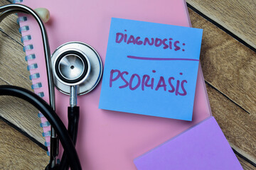 Concept of Diagnosis Psoriasis write on sticky notes isolated on Wooden Table.