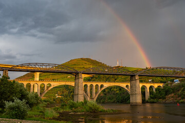 Sunset above the bridge and grape vines in the Douro Valley Portugal at the beginning of summer