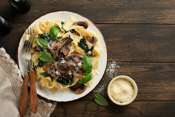 Creamy Alfredo pasta. Italian pasta fettuccini with mushrooms, chicken meat, spinach, basil and...