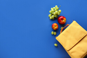 Lunch box bag with different fruits on blue background