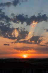 wonderful sunset on a summer evening in istanbul. The sun looks beautiful among the clouds.