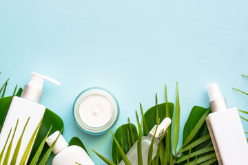 Natural cosmetic products with green leaves.