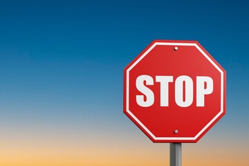 A red alarm stop sign at blue sky background