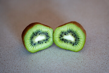 Kiwi fruit sliced in half. Two halves of fresh kiwi fruit