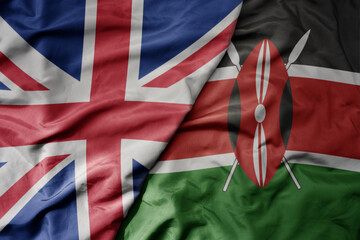 big waving national colorful flag of great britain and national flag of kenya .