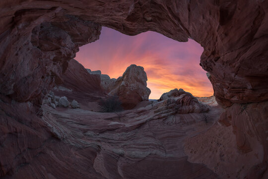 Rocky mountains under bright sky at sunset
