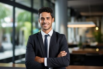 Fototapeta premium Portrait of a fictional businessman in suit smiling in an office. Generative AI.