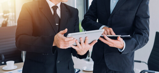 Teamwork with business people analysis cost graph on desk at meeting room.