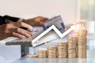 Interest rate concept, Businessman calculates investment in percentages.