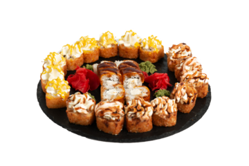 sushi set. different types of sushi on a big round black dish. Sushi set on a black slate.