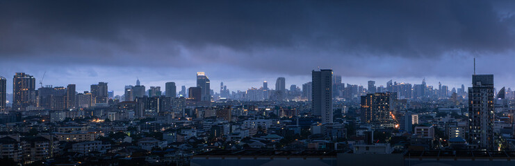 Panorama of the city of Bangkok in Thailand before the storm in the twilight , rainy season thick clouds cover the city, global warming concept
