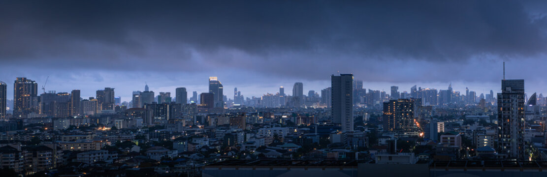 Panorama of the city of Bangkok in Thailand before the storm in the twilight , rainy season thick clouds cover the city, global warming concept