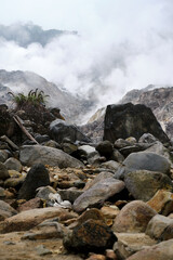 Wisps of smoke around the crater scattered rocks