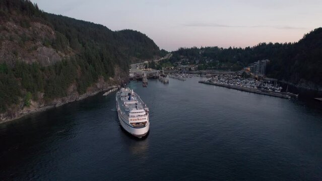 Car ferry on the ocean with a beautiful ocean and mountain view at sunset, Howe Sound, BC, sea, aerial drone footage. 4K 24FPS PRORES 422