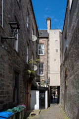 25 July 2023.Elgin,Moray,Scotland. This is a lane extending onto High Street in Elgin on a sunny day.
