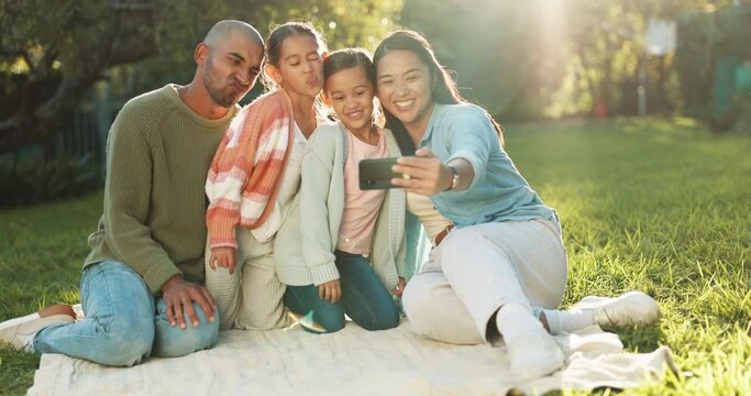 Happy family, selfie and picnic blanket at park to relax, bonding or together on holiday. Photography, funny and mother, father and kids at garden with love, care or profile picture in nature outdoor
